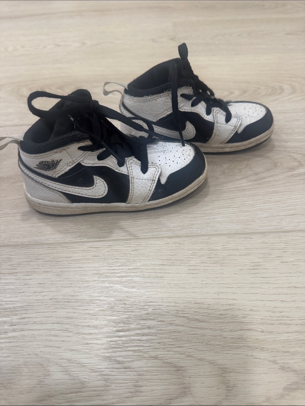 Nike Jordan’s Kids Black and White High-Top Sneakers